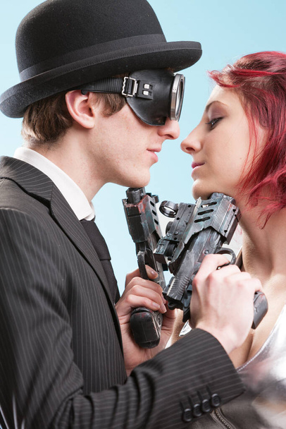 Espionage and romance entwine. Two steampunk spies, torn between fervent love and a ruthless rivalry - Photo, Image