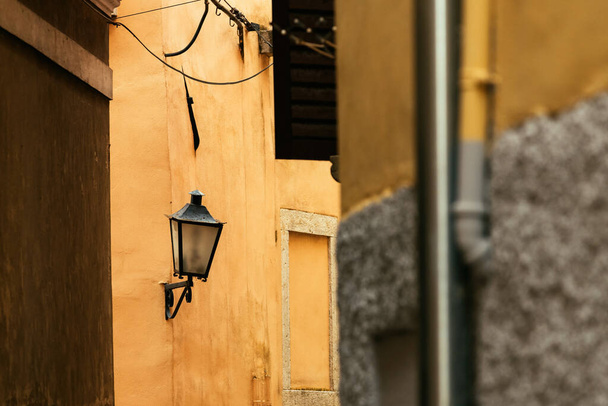 Vintage street light lantern in old town of Lovran in Croatia, selective focus - Фото, зображення