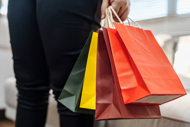 Woman holding sale shopping bags. consumerism shoppe - Fotó, kép
