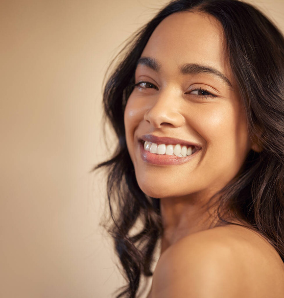 Closeup portrait of beautiful young mixed race woman with healthy skin and toothy smile. Latin hispanic woman with flawless skin after facial treatment smiling and looking at camera. Natural beauty girl with perfect skin. - Valokuva, kuva