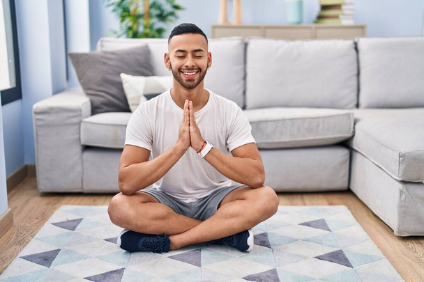 African american man smiling confident training yoga at home - Fotó, kép