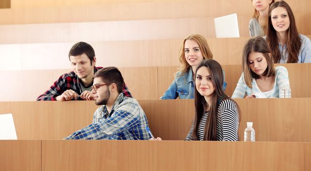 Group of students sitting in classroom - Foto, Bild