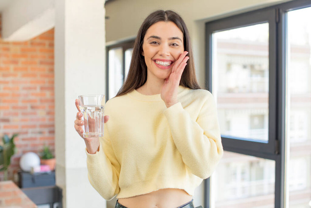 pretty young model feeling happy and astonished at something unbelievable. water glass concept - Foto, Imagem