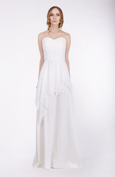 Fashion Model Standing in Long White Dress - Foto, Imagen