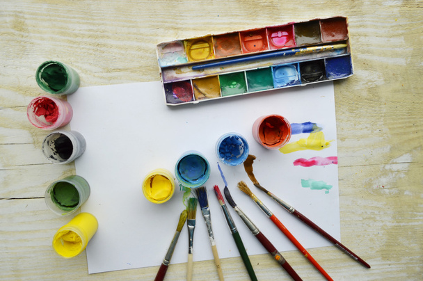 Painting, paint, brushes for painting, landscape paper, creativity on the wooden background - 写真・画像