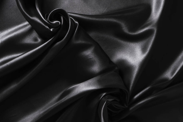 Background black twisted silk fabric,abstract texture satin fabric - Photo, Image