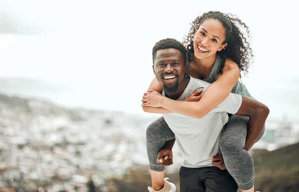 Happy couple in portrait, piggyback and hiking outdoor with smile and fitness with interracial people. Mockup space, workout together and trekking, black man with woman and happiness in relationship. - Foto, imagen