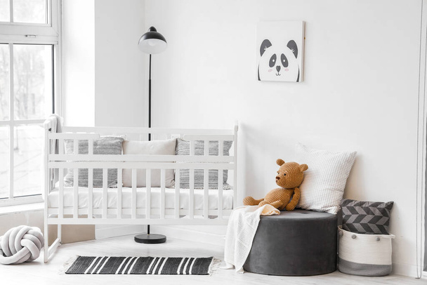 Stylish interior of children's room  with baby bed and ottoman - Foto, immagini