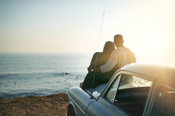 Ill go anywhere with you. a young couple making a stop at the beach while out on a roadtrip - Фото, изображение