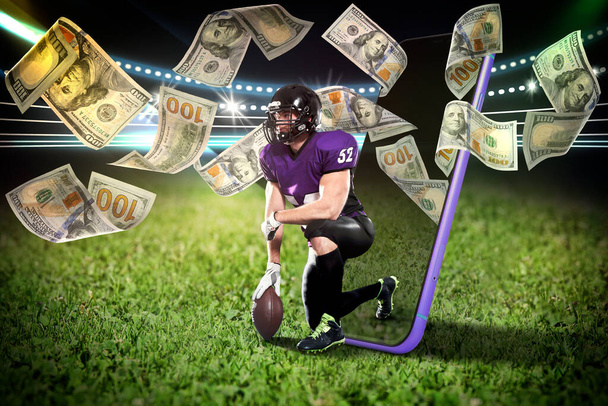 Sports betting. American football player appearing from smartphone on field under money shower - Φωτογραφία, εικόνα