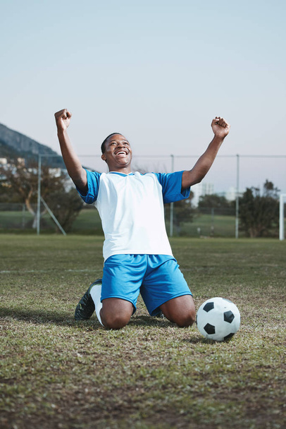Soccer ball, sports and man celebrate goal on field for competition, fitness or training outdoor. Black male athlete football player, pitch and game celebration for sport achievement, success or win. - Valokuva, kuva