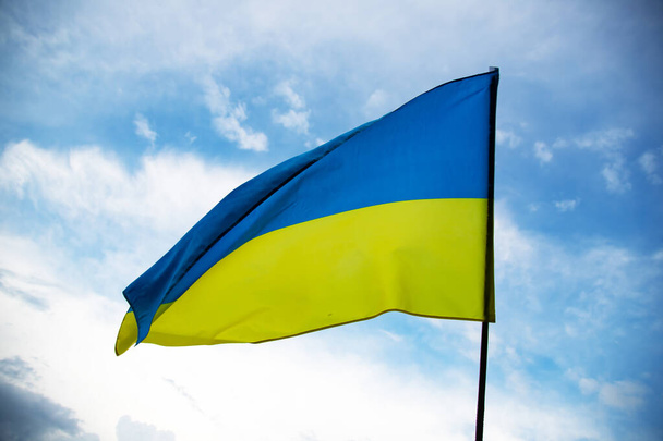 Flag of Ukraine waving in the wind on a clear day. Democracy and politics.  - Zdjęcie, obraz
