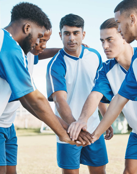 Soccer, sports group or team with hands together on field for fitness training or competition. Football player, club and diversity athlete men together for scrum, game motivation or teamwork outdoor. - Фото, зображення