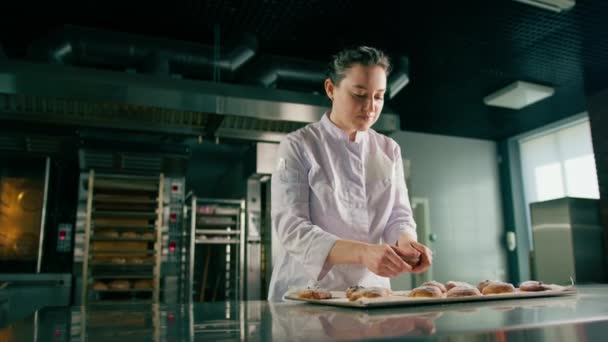 beautiful woman baker tears ready freshly baked hot aromatic buns checks dough bakery production - Footage, Video