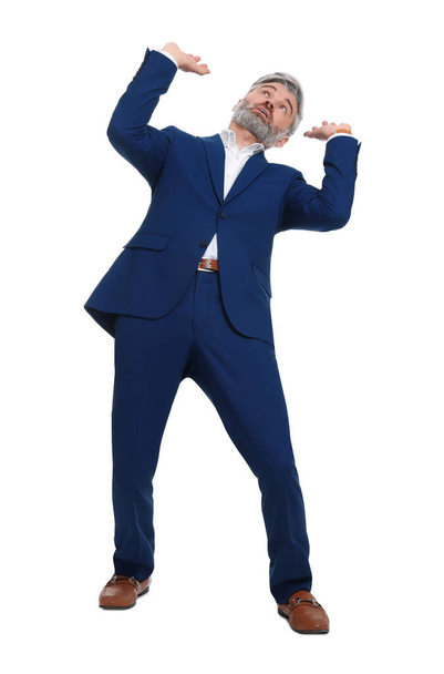 Mature businessman in stylish clothes avoiding something on white background - Foto, afbeelding