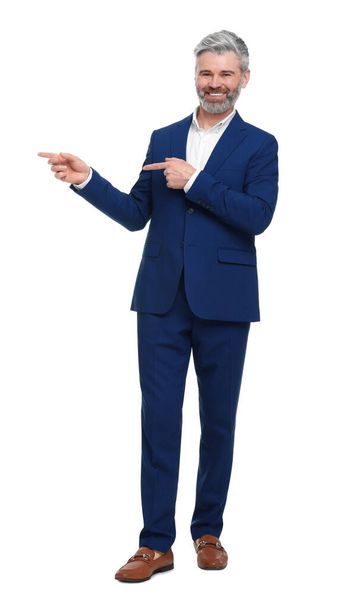 Mature businessman in stylish clothes posing on white background - Foto, Imagem