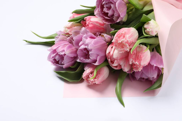 Beautiful bouquet of colorful tulip flowers on white background - Fotó, kép