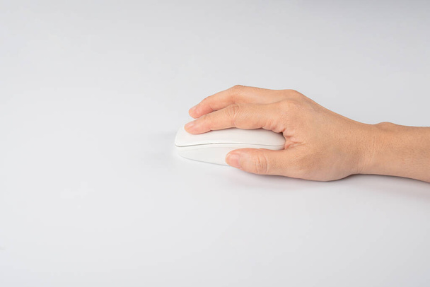 Hand click on modern computer mouse isolated on a white background - Foto, imagen