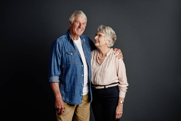 She is my happily ever after. Studio portrait of an affectionate senior couple posing against a grey background - Foto, Bild