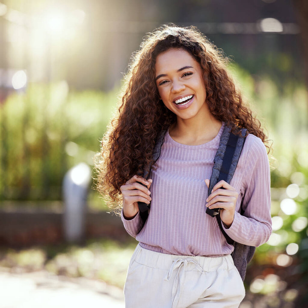 Woman with smile, backpack and student in campus garden, university with education and happy studying. Excited female person in outdoor portrait, academic scholarship and mockup space and college. - Foto, imagen
