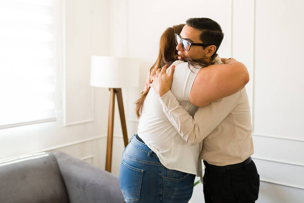 Professional psychologist hugging his woman patient after helping with depression and mental health problems in therapy - Photo, Image