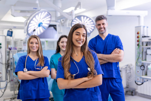 Medical professionals standing together. concept of health protection. Successful team of medical doctors are looking at camera and smiling while standing in hospital - Фото, зображення
