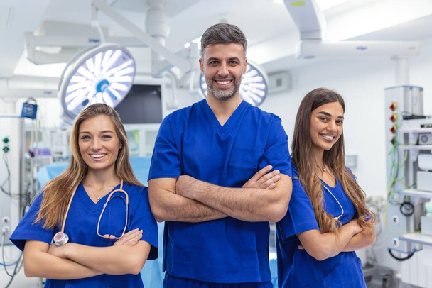 Medical professionals standing together. concept of health protection. Successful team of medical doctors are looking at camera and smiling while standing in hospital - Photo, image