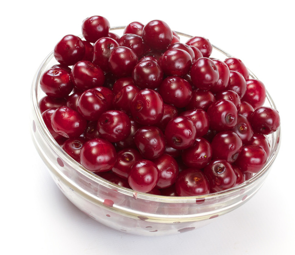 Bowl with ripe cherries. Isolated on a white background. - Zdjęcie, obraz