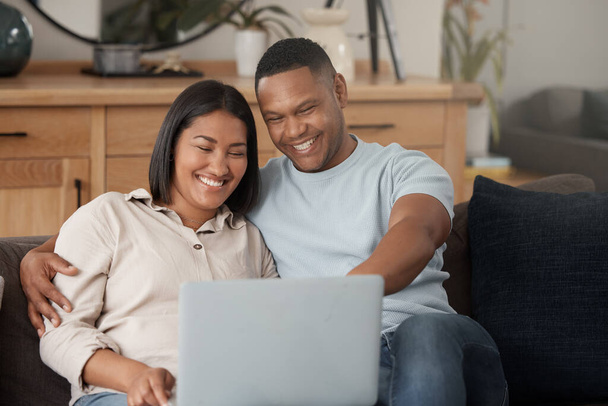 Couple, laptop and smile for movie on couch with online subscription, media download and relax together. Happy man, woman and computer technology for streaming, internet and connection in living room. - Photo, Image