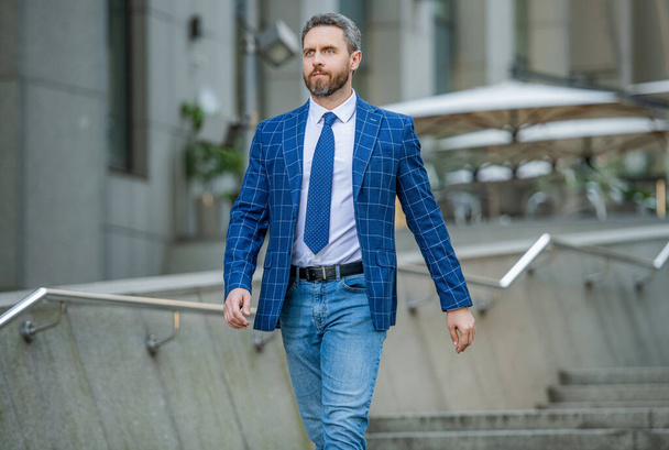 business man wearing jacket walking in the street. photo of business man with tie. business man outdoor. business man on urban background. - Φωτογραφία, εικόνα
