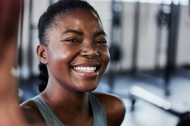 Gym, portrait or black woman with smile in selfie on workout, exercise or training break on social media. Funny influencer, face or happy African girl smiling for pictures or online fitness content. - Photo, image