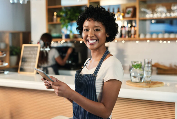 Happy woman, tablet and portrait of waitress at cafe for order, inventory or checking stock at restaurant. Female person, barista or employee on technology in small business management at coffee shop. - Photo, Image