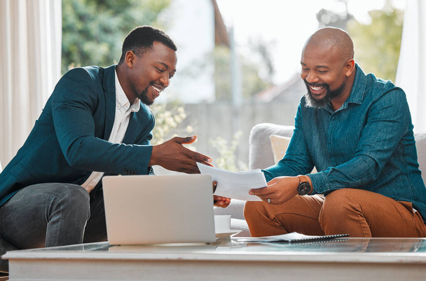 Broker, contract and black man in a house with a client for meeting or consultation for advice. Financial advisor with male person to talk about investment, savings plan or budget and insurance paper. - Photo, Image