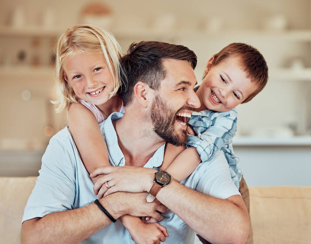 Man, kids and smile for piggyback in living room with playful childhood, happiness and fathers day in family home. Happy children hug dad for bond, love and care to relax in lounge for quality time. - Photo, Image