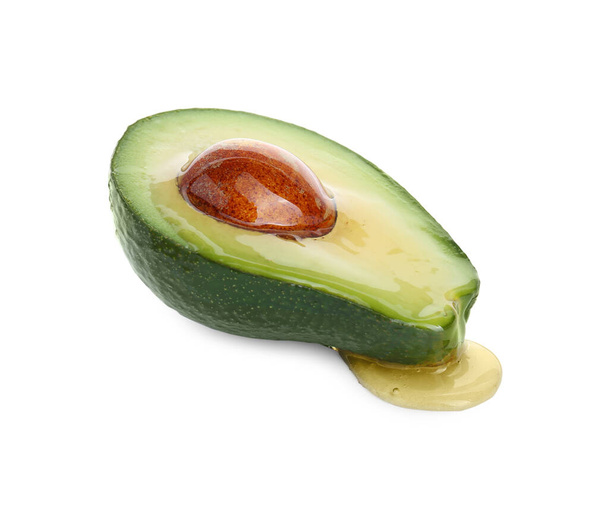 Half of avocado with essential oil isolated on white - Φωτογραφία, εικόνα