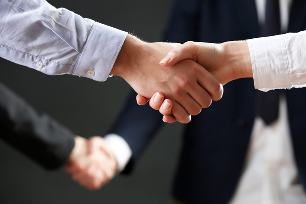 Business handshake on dark background - Zdjęcie, obraz