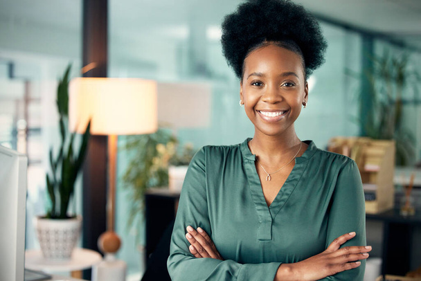 Confidence, crossed arms and portrait of a woman in her office with pride and leadership. Corporate, professional and African female executive business ceo with vision, ideas and goals in workplace - Фото, зображення