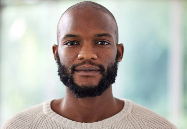 Face, serious and black man at creative business, startup and career mindset, confident and casual on blurred background. Portrait or headshot of a young African person, worker or entrepreneur in USA. - Fotografie, Obrázek