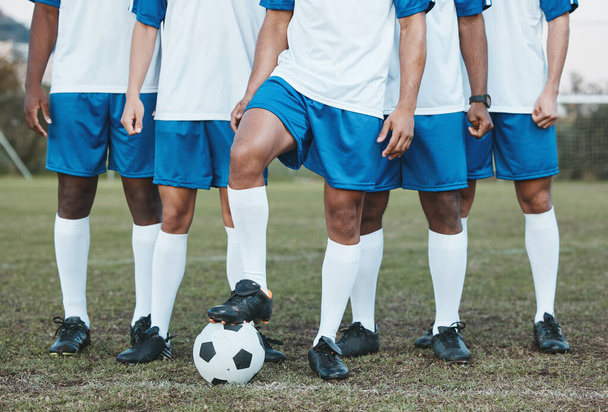 Soccer ball, sports group and feet of a team on a field to start fitness training or game outdoor. Football player, club and legs of athlete men together for sport competition, exercise and challenge. - 写真・画像