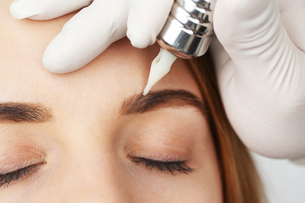 Cosmetologist making permanent makeup, close up - Φωτογραφία, εικόνα