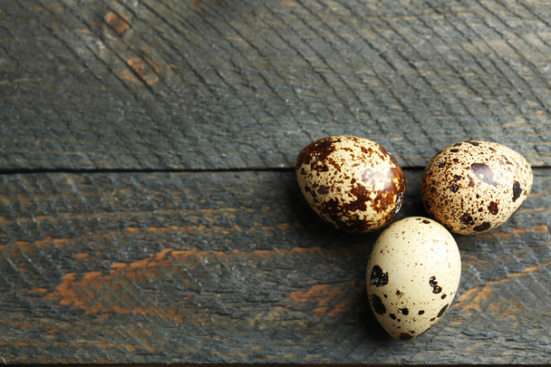 Bird eggs on wooden background - Фото, изображение