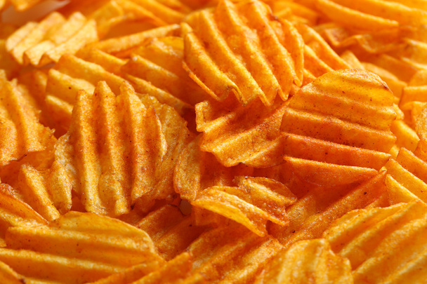 Delicious potato chips closeup background - Foto, Imagen