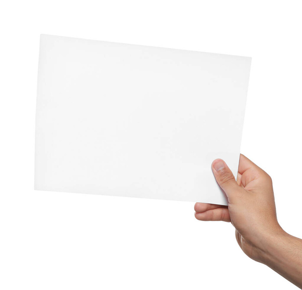 Man holding sheet of paper on white background, closeup. Mockup for design - Foto, Imagem
