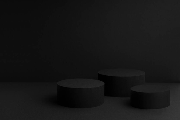 Abstract black stage with three round podiums mockup for presentation cosmetic products, goods, advertising, design, sale, text, display, showing, gradient in contemporary urban style, copy space. - Photo, image