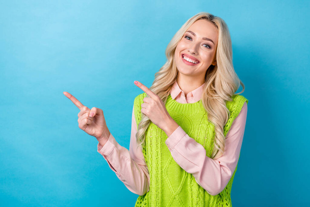 Photo of pretty lady worker direct fingers empty space novelty billboard wear smart casual outfit isolated blue color background. - Fotoğraf, Görsel