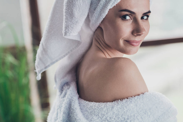 Closeup photo of gorgeous lady doing morning procedures after shower vitality anti age lifestyle teasing look camera indoors. - Фото, зображення