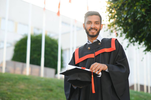 education, graduation and people concept - happy Indian Male graduate student - Foto, imagen