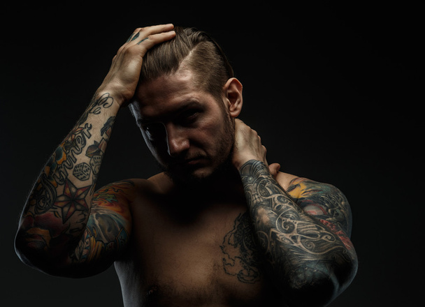Portrait of a man with tattoos. - 写真・画像