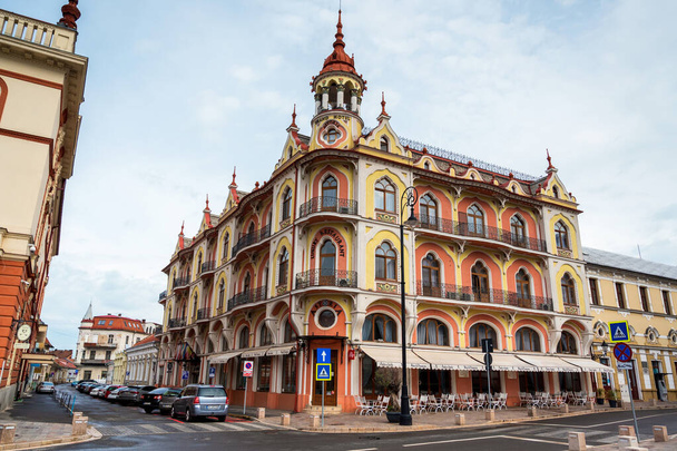 ORADEA, ROMANIA - MAY, 2023: Street view of the city downtown. Hotel and restaurant building made in national style, empty street - Photo, Image