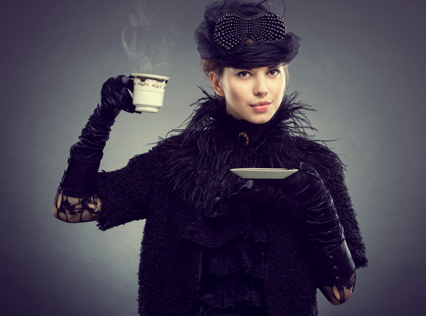 Retro style woman holding cup - Photo, Image